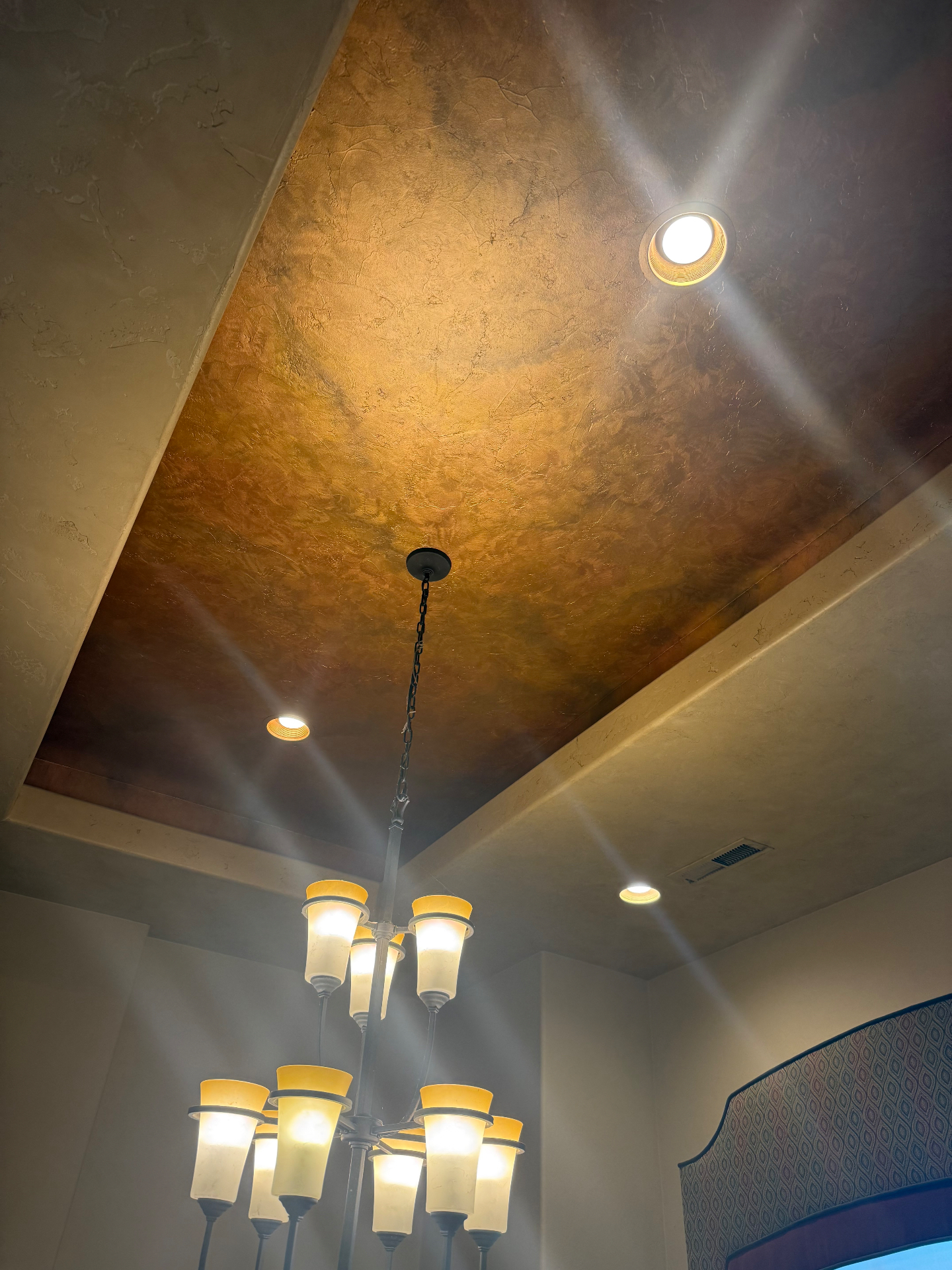 Repaired ceiling with smooth finish, chandelier and recessed lighting